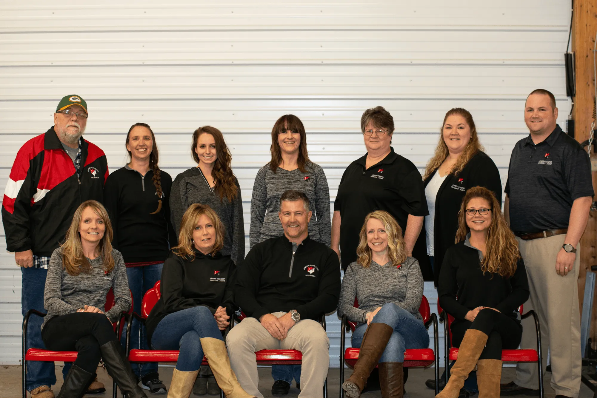 Group photo of Jensen-Sundquist Insurance Agency team members, showcasing their commitment to customer service in northwest Wisconsin.