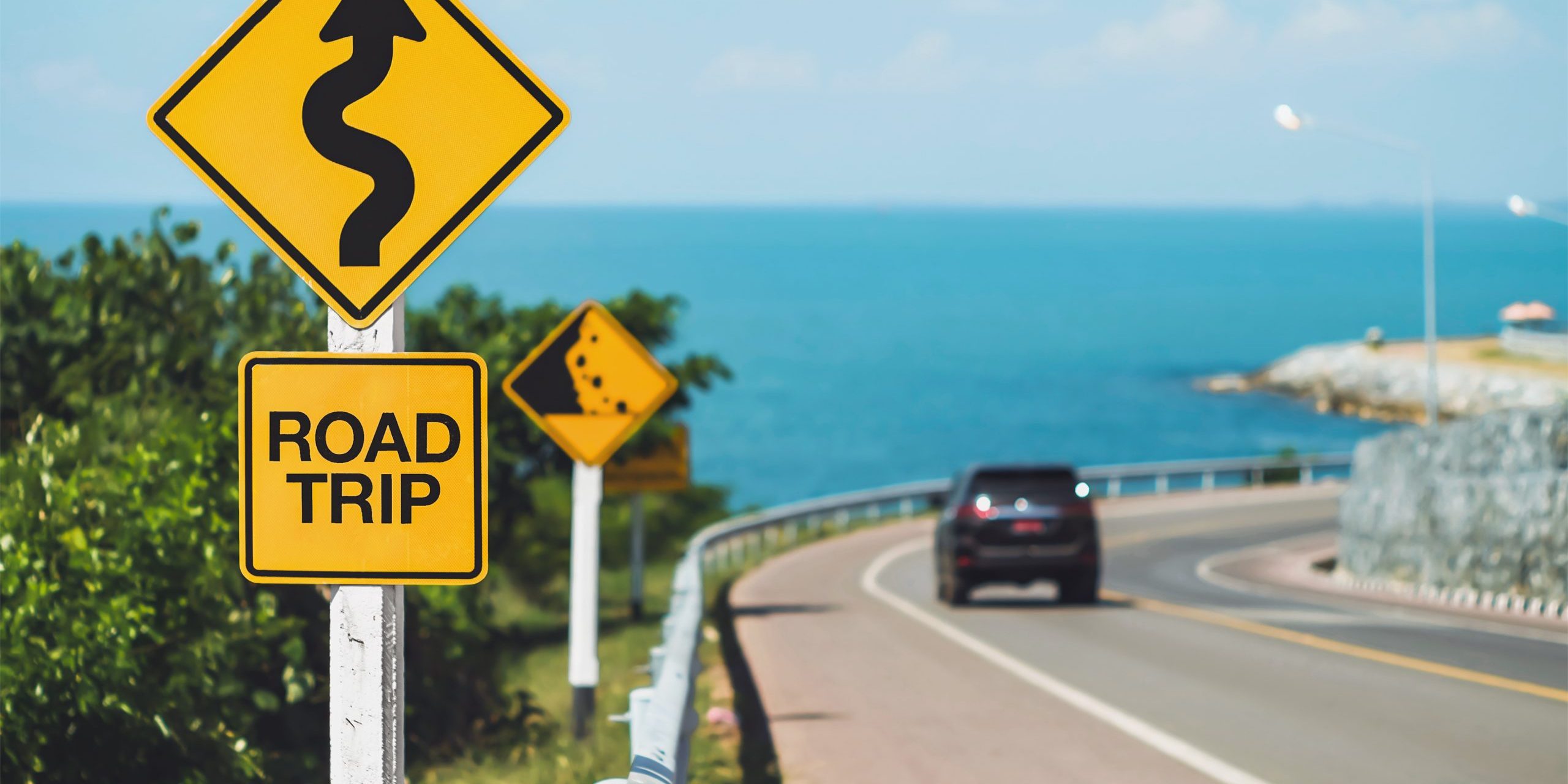road trip road trip word and curvy road sign